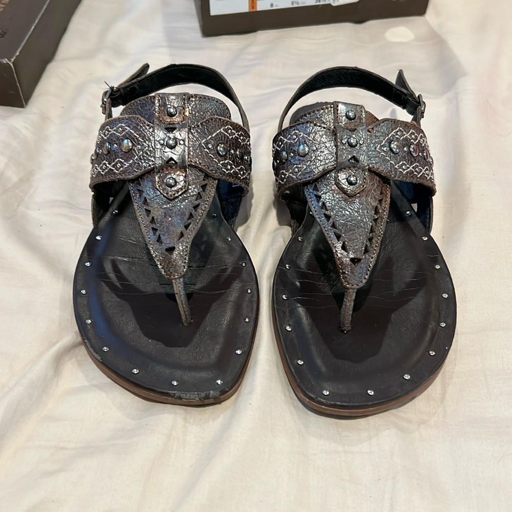 Ariat sandals, good condition. One has a scuff on the edge, see photos.